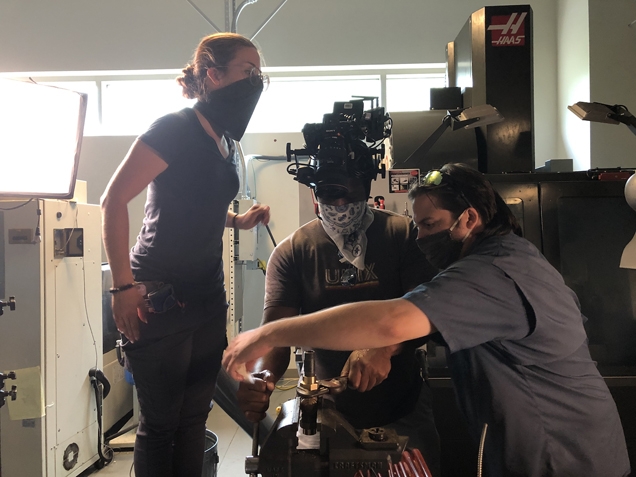 iostudio's video production team behind the scenes at the NC State video shoot using the helmet cam