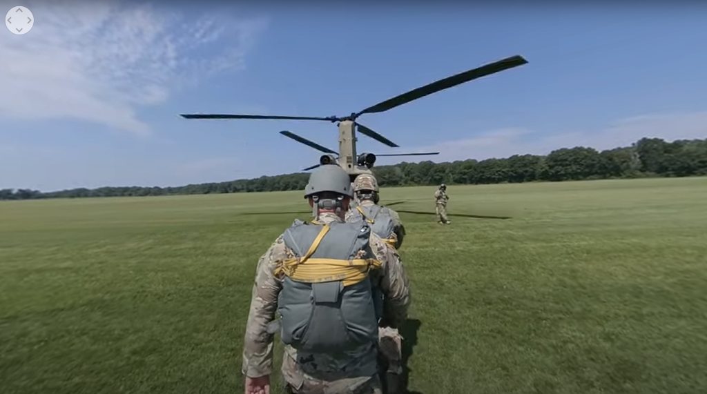 Soldiers walking into a helicopter.